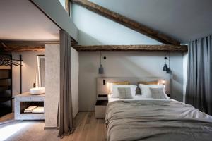 Ein Bett oder Betten in einem Zimmer der Unterkunft Monastero Arx Vivendi