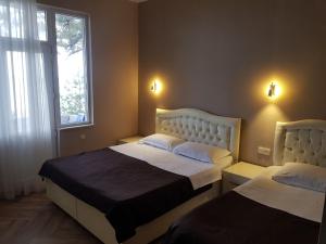 Letto o letti in una camera di MIDIA Guest House