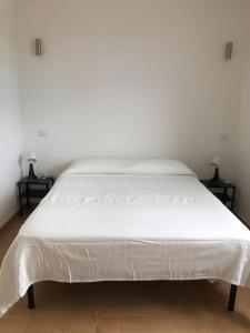 Ένα ή περισσότερα κρεβάτια σε δωμάτιο στο La Finestra sul Porto Golfo Aranci