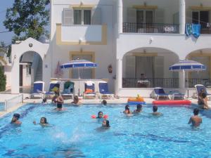 a group of people in a swimming pool at Alessandro in Sidari