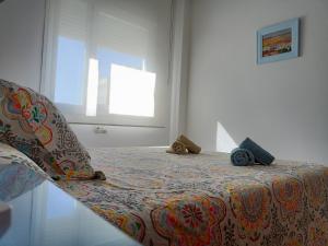 En eller flere senge i et værelse på Apartamentos Coralba - Dúplex Bahía de Cádiz