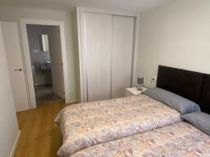A bed or beds in a room at Piso Lectra 2