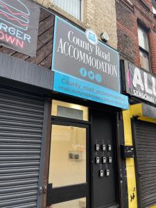 a store front with a sign above the door at County serviced accommodation in Liverpool