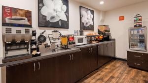 a kitchen with a counter top with appliances at SureStay Hotel by Best Western Beverly Hills West LA in Los Angeles