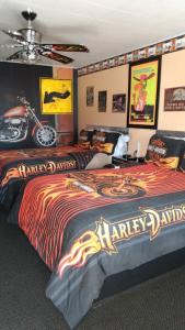 a bedroom with a bed with a harley davidson blanket at Galaxy of Harley Bikers Between Bryce and Zion in Hatch