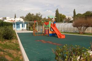 a playground with a slide in a park at Favorite at Senhora da Rocha in Porches