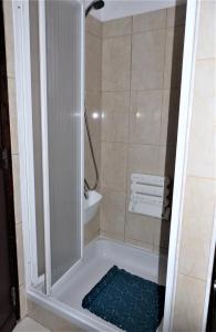a shower with a glass door in a bathroom at Favorite at Senhora da Rocha in Porches +47 photos