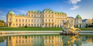 a building with a fountain in front of a building at Elegant Vienna Apartment in Vienna