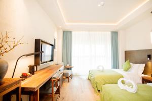 TV o dispositivi per l'intrattenimento presso Jinling Onejoy Hotel