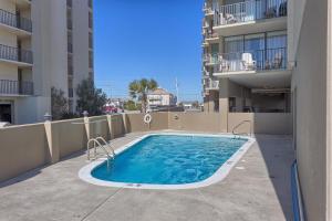 a swimming pool on the side of a building at Gulf House II in Gulf Shores