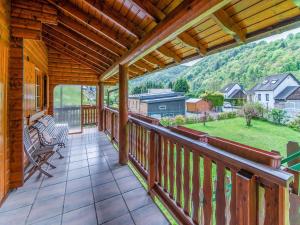 a porch with a view of a mountain at Chalet in Sougn Remouchamps near Ardennes Forest in Sougné-Remouchamps