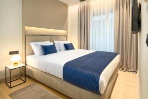 Кровать или кровати в номере Boutique Hotel Porto