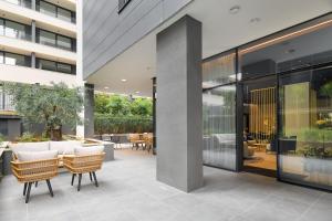 a courtyard with chairs and tables in a building at Boutique Hotel Porto in Dubrovnik