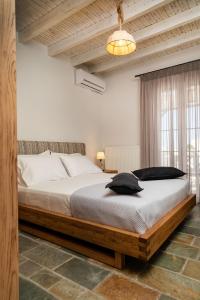 Ένα ή περισσότερα κρεβάτια σε δωμάτιο στο Naxian Icon Luxury Residence
