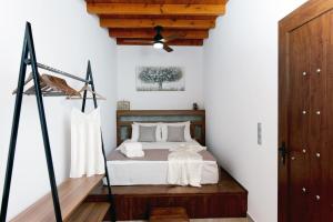 Posteľ alebo postele v izbe v ubytovaní Paraskevi Luxury Apartments
