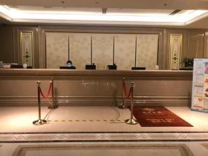 a courtroom with red ribbon barriers in a room at Taizhou Haiyan Jinling International Hotel in Taizhou