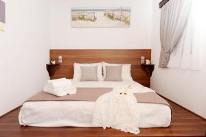 Posteľ alebo postele v izbe v ubytovaní Paraskevi Luxury Apartments