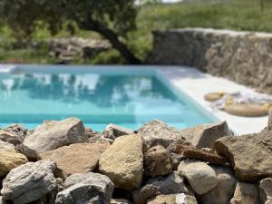 The swimming pool at or close to Masía La Costereta