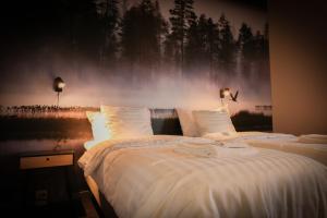 Park Hotel Liminka tesisinde bir odada yatak veya yataklar
