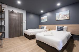 Katil atau katil-katil dalam bilik di Oblique Apartment - ออฟบลิค อพาร์ทเมนท์