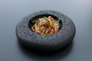 a small black bowl filled with popcorn and sprinkles at VIVOOD Landscape Hotel & Spa - Designed for Adults in Benimantell