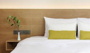 Postel nebo postele na pokoji v ubytování Bloom Hotel