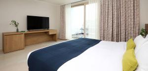 Postel nebo postele na pokoji v ubytování Bloom Hotel