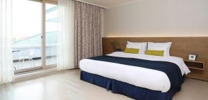 Postel nebo postele na pokoji v ubytování Bloom Hotel