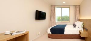 TV a/nebo společenská místnost v ubytování Bloom Hotel