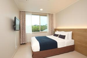 Postel nebo postele na pokoji v ubytování Bloom Hotel