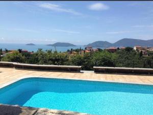 a swimming pool with a view of the ocean at Villa Antonini in Lerici