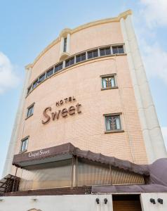 a building with the words north sweet on it at Hotel Chapel Sweet (Adult Only) in Kobe