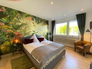 מיטה או מיטות בחדר ב-Urban Jungle Apartment in Kassel + Netflix