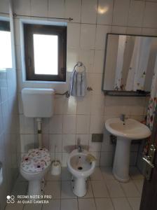 a bathroom with a toilet and a sink at Katarina in Bijela