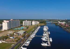 a group of boats are docked in a harbor at Yacht Club Villas #1-202 condo in Myrtle Beach
