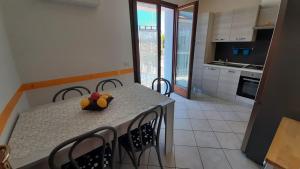 a kitchen with a table with a stuffed animal on it at La Casa Azzurra in Misano Adriatico