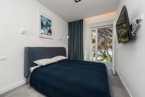 Posteľ alebo postele v izbe v ubytovaní Royal Apartments Zadar