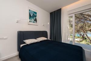 Krevet ili kreveti u jedinici u okviru objekta Royal Apartments Zadar