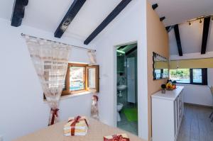 a bathroom with a sink and a toilet in a room at Apartments Melany in Slano +28 photos