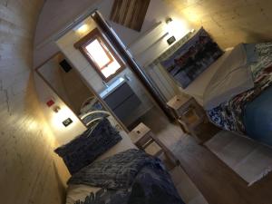 an overhead view of a bedroom with two beds and a window at piccadilly b&b in Pordenone