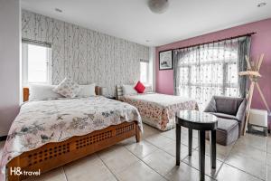 Postel nebo postele na pokoji v ubytování White Cotton Candy Homestay