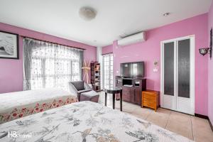 Postel nebo postele na pokoji v ubytování White Cotton Candy Homestay