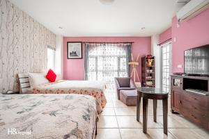 Postel nebo postele na pokoji v ubytování White Cotton Candy Homestay