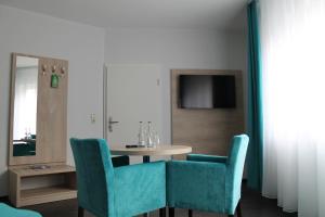 TV a/nebo společenská místnost v ubytování Hotel Steakhouse Am Rathaus