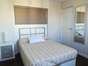 En eller flere senger på et rom på Cumbre Loix Apartment