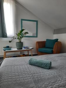 Posteľ alebo postele v izbe v ubytovaní Kamilla Apartman Villapark