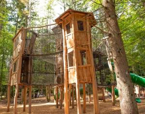a wooden tree house in a park at Gästehaus Kühnle in Bad Wildbad