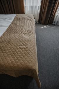 a bed in a hotel room with at Sleepers Avia Hotel DME in Domodedovo