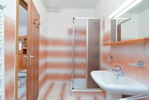 a bathroom with a sink and a shower at Apartment Anton 2083 in Premantura +19 photos