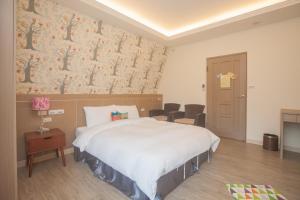 Postel nebo postele na pokoji v ubytování Lusihan B&B
